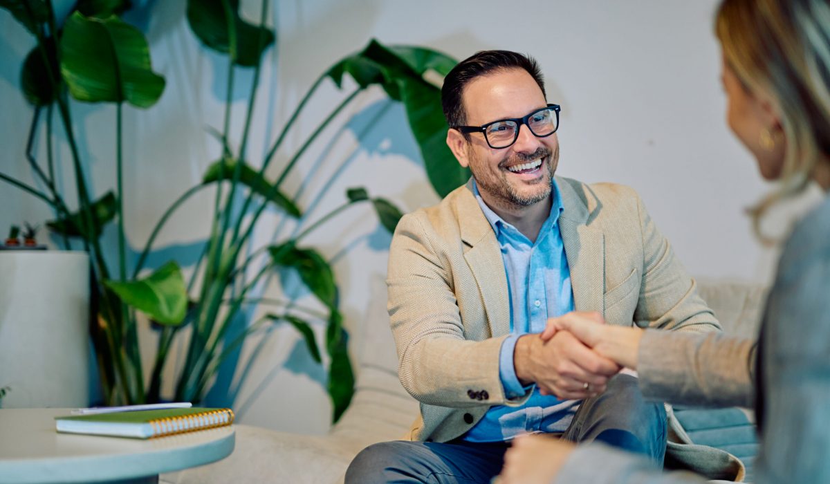 Business people shaking hands agreeing on partnership deal